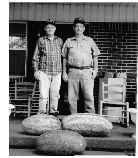 A neighbor with my grandfather with their record watermelons