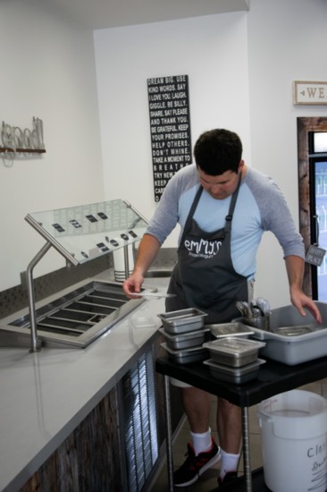 Michael is responsible for prepping the shop to open.