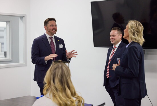 Pensacola Mayor DC Reeves talks with COO Tyson Lamond and staff
