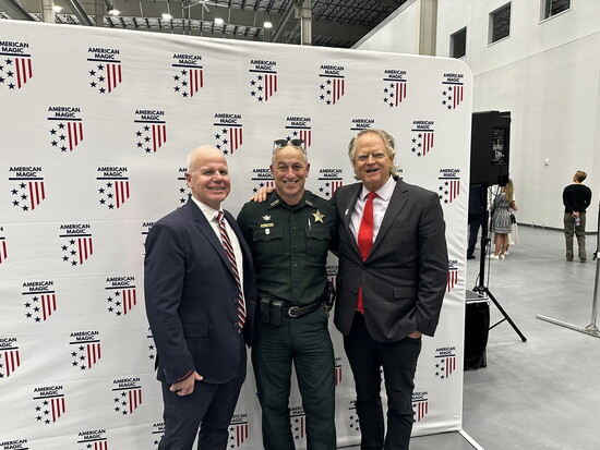 American Magic's Terry Hutchinson with Sheriff Chip Simmons and Collier Merrill of Pensacola