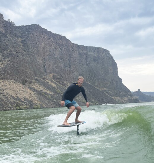 Dan Lay, AWS General Manager, wake foiling on Lake Billy Chinook. 