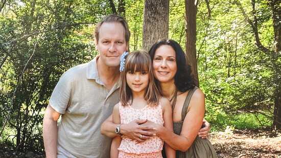 Carmela with her husband, Geoffrey Lynch, and daughter Elisabeth. Photo by crazylovecreative.com.
