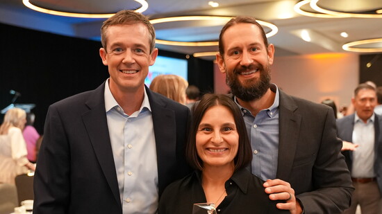 Aaron von Flatern, Margaret von Flatern, and Josh Fogelman accepting the Charitable Champion award at the Austin Gives Awards.