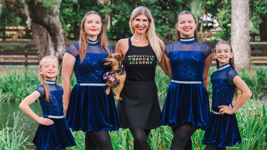 Gainesville Dance Academy's Gloria Westfall, Cara Murray with Orla the Irish Terrier, Director Sarah Ingley, Naomi Fisher, and Addison Griffin.