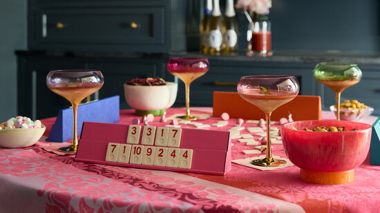 Babcock Gifts La Jacquard tablecloth, Brouk & Co Rummikub set and Simon Pearce heart dishes. Mrs. Post Glitterville coupes and Beatriz Ball footed bowls.