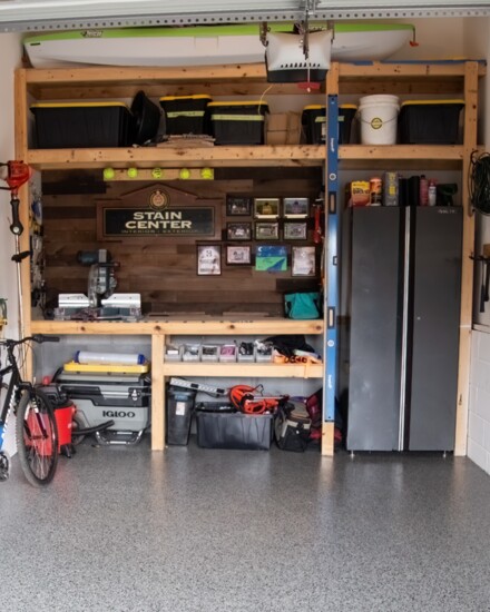 A well-organized garage with a custom woodworking bench is ready for home projects.