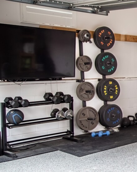 Garages are the perfect places for home gyms, particularly with flat panel televisions on the wall.