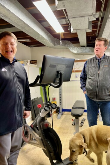 Steve Alton (L) and Stutz show Publisher Michael Beightol the workout room