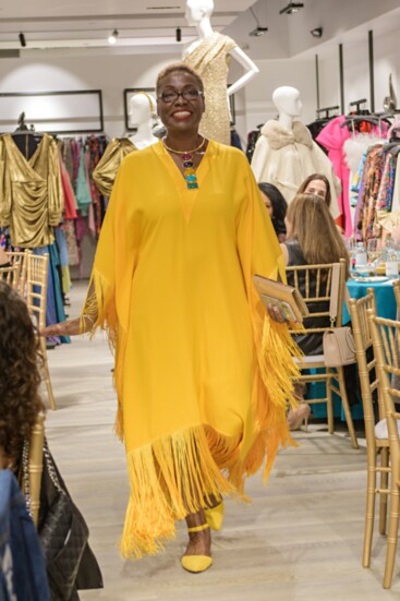 Janice Webb rocking her vibrant yello kaftan at this year's Teal to Heal Fashion Show.