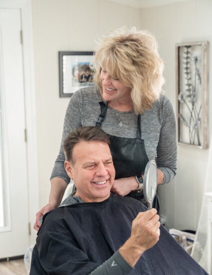 Mark Lynn is pleased with the haircut he received from master stylist Bonnie Upton.