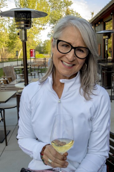 Michelle Moreau Keener poses with a glass on the Telaya Wine Co. patio