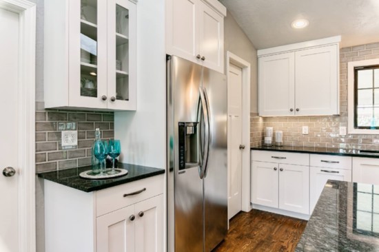 Install lighter cabinets for a bigger feel. If you're wanting to open up your space, consider white or another light color.