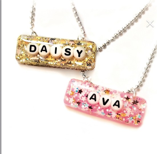 Oh Spit Baby Gifts Eco-Friendly, Resin Necklace Personalized With Any Child’s Name, $32, email Ohspitbaby@gmail.com to place your custom order