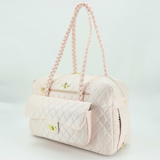 The classy canine owner will love the luxury handbag-inspired dog carriers at Pucci Cafe. Porsha Dog Carrier puccicafe.com $360 