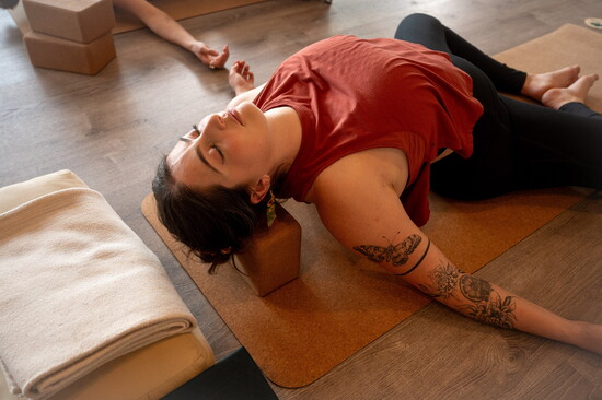 Madi performing the Supported Fish Pose