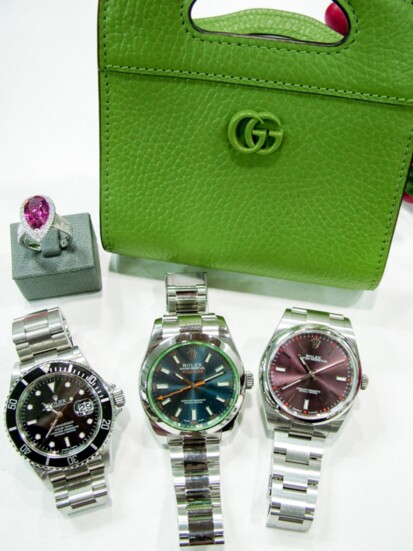 Ruby and diamond ring, Gucci purse, Rolex Submariner, Rolex Milgaus, and Rolex Oyster Perpetual