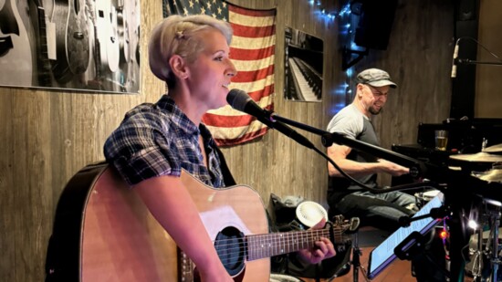 Introducing her next song: at Red Barn, with Bryan Sansom on drums. Photo: Stephen Neilson.