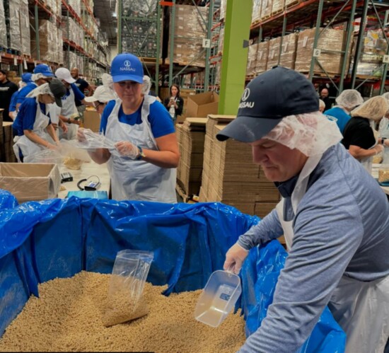 Connecticut Foodshare staff process food at the organization's facility in Connecticut. 