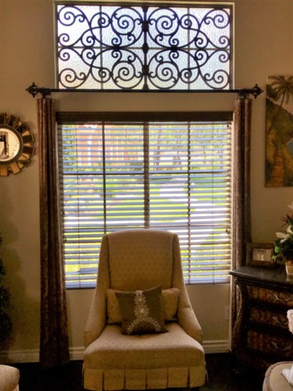 Faux iron covers a view of power lines and is a beautiful design over a window.