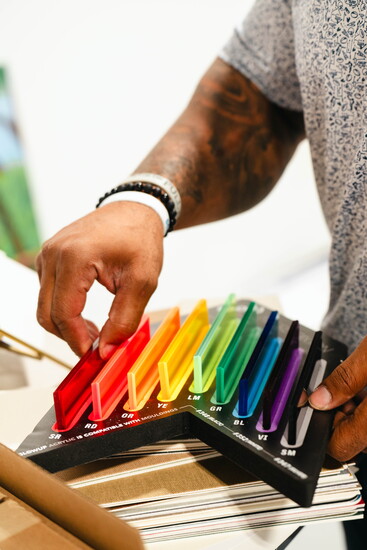 Former Houston Texans football player, Glover Quin works on a custom frame inside his Memorial shop, where precision guides every piece.