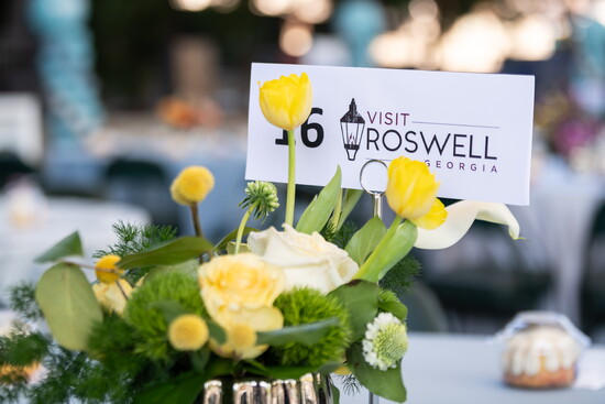 Visit Roswell representing with a table 