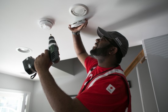 A Red Cross volunteer team heads out to install free smoke alarms, in April 2019. 