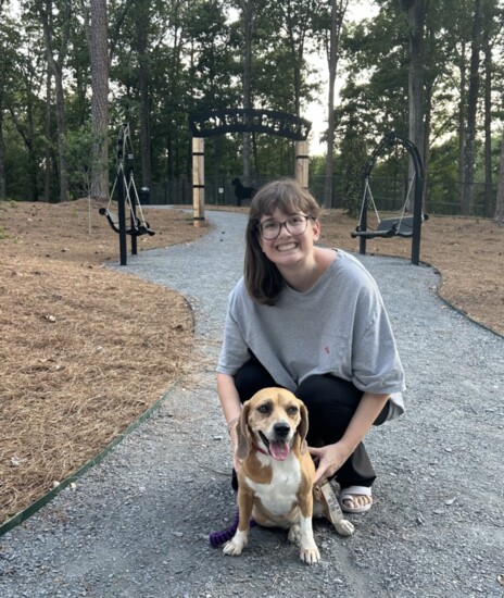 Poppy and her owner strike a pose in front of the new dog park. 
