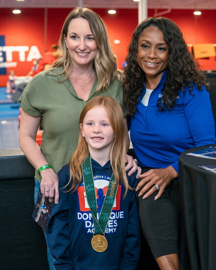 Sharing her medal with student