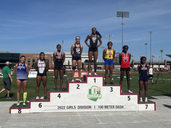 Track State Champion A'Zariyah Bryant at the top of the podium