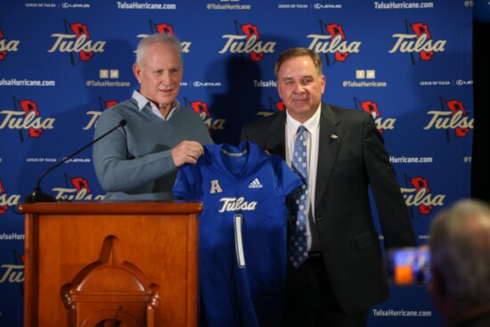 Football Coach Kevin Wilson receiving his University of Tulsa football jersey. Photo provided.