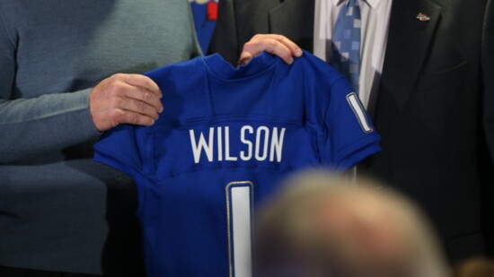 Football Coach Kevin Wilson receiving his University of Tulsa football jersey. Photo provided.