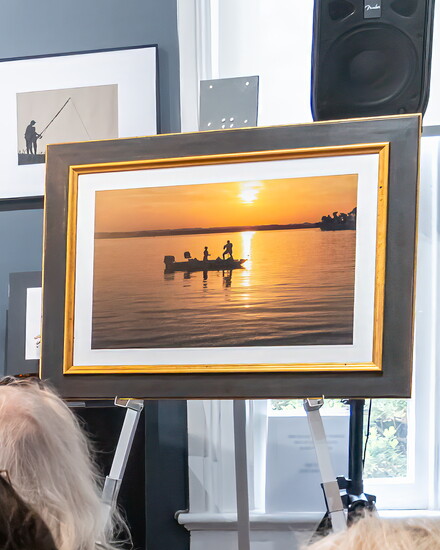 Various works by Willam Lee Golden were on display during his book presentation, including this one featuring fishermen on Old Hickory Lake.