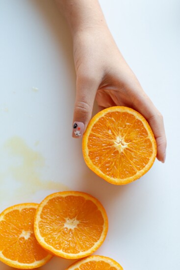 Thinly slice and dehydrate the oranges.