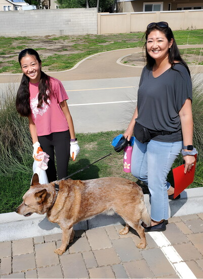 Brandie Siu, her daughter Haylee, and their dog Cooper share a morning of community service.