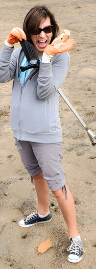 Patricia Anaya is all smiles after turning a little Greenway litter into a cleaner trail for everyone.