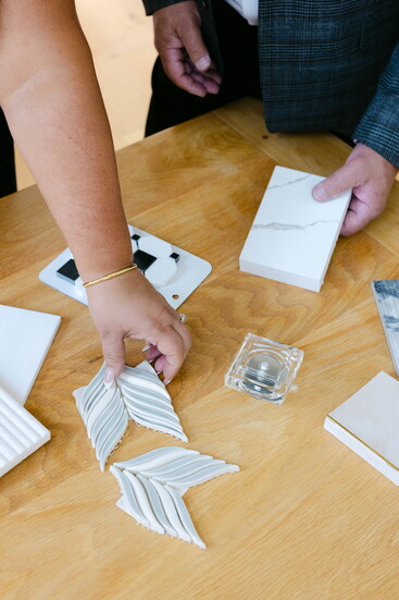 Side by side, they evaluate surfaces and finishes, guiding clients through decisions that shape the final look of a space.