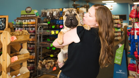 Winter with her owner, Jessica Zumbrun, shop for treats at J & T Feeds.
