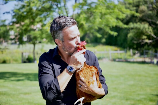 Local Fabio Viviani with his favorite chicken, Red, in Barrington Hills.