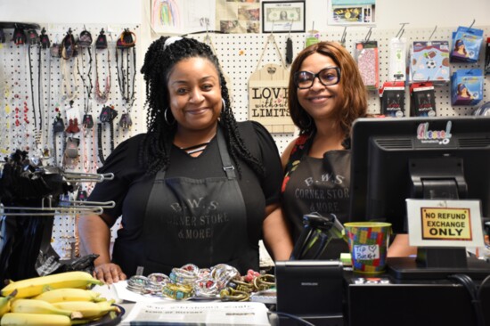 Shop owner Angela Robson and Kay Andrews greet customers at Black Wall Street Corner Store and More. Photo by Nancy Hermann.