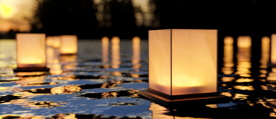 Paper lanterns lit to float symbolizing the loss children