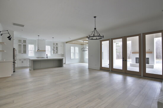 Style That Stands Up: Luxury vinyl plank flooring offers the beauty of wood with the durability needed for high-traffic family living.