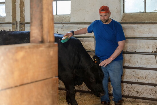 Resident with cattle at Char Hope. Photo Credit: Kerry Paradis Photography