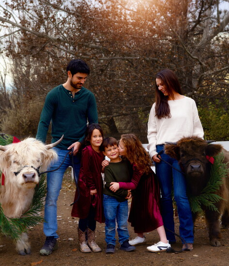 The Alvarez family with highland cows, Ken and John Wayne. Photography by Preserving Euphoria.