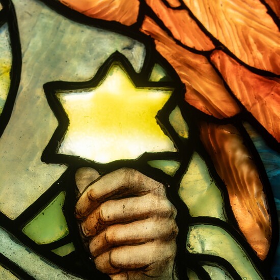 Symbolic details throughout the windows come alive through color, texture and light.