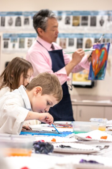 Art teacher Byron Shen instructs young artists. 