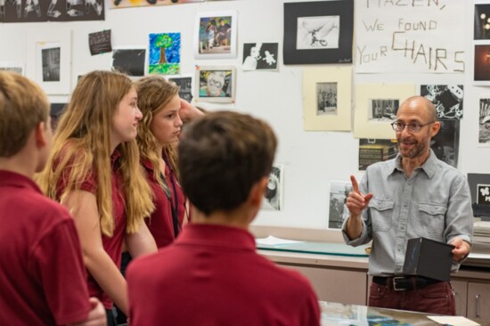 Photography teacher Mazen Abufadil instructs students. 