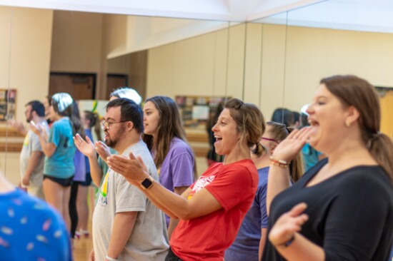 Theater teacher Leslie Long coaches students in her theater class for people with Down Syndrome.