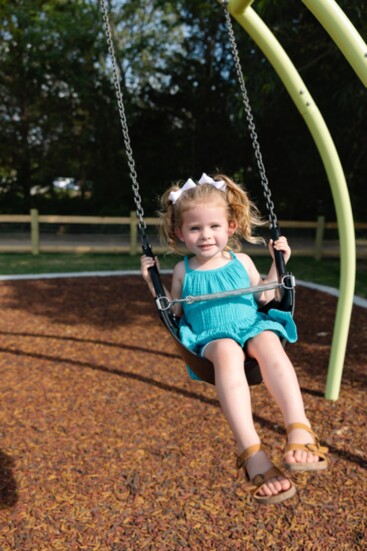 Evie Erstine (2), daughter of David and Natalie Erstine, loves the new swing set. 
