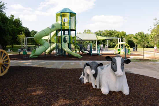 The new play structure and custom-built cows provide a place for imagination and play.