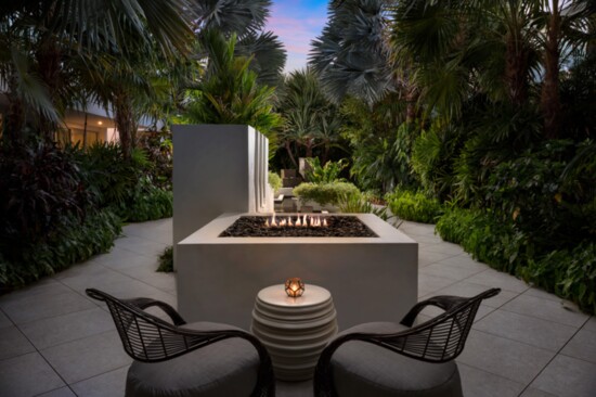 The fire pit area provides a cozy and intimate setting of tropical ambiance